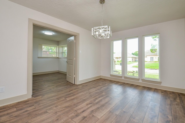 14835 Charlmont Dr, Houston, TX 77083 - empty room featuring a chandelier and wood finished floors