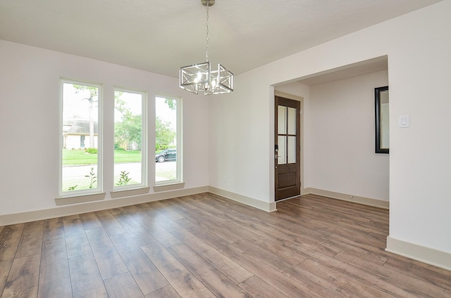 14835 Charlmont Dr, Houston, TX 77083 - spare room with a chandelier and light wood finished floors