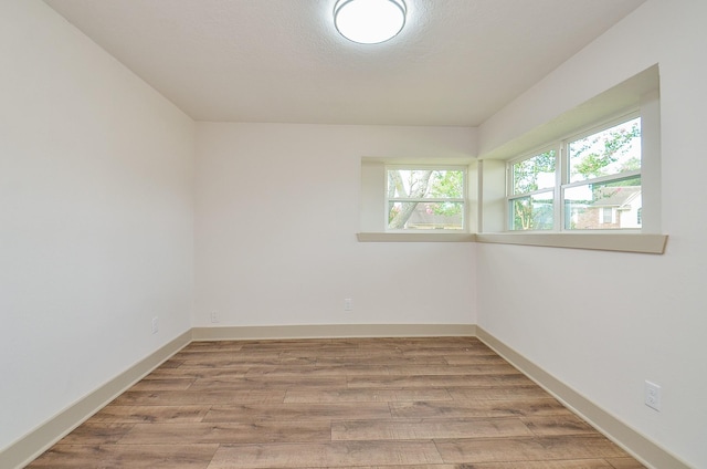 14835 Charlmont Dr, Houston, TX 77083 - empty room featuring light wood-style flooring and baseboards
