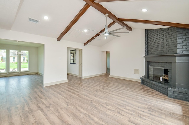 14835 Charlmont Dr, Houston, TX 77083 - unfurnished living room featuring a chandelier, a fireplace, a ceiling fan, wood finished floors, and recessed lighting