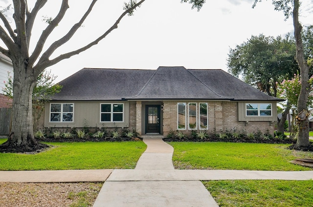 14835 Charlmont Dr, Houston, TX 77083 - view of front facade with a front yard, roof with shingles, and brick siding