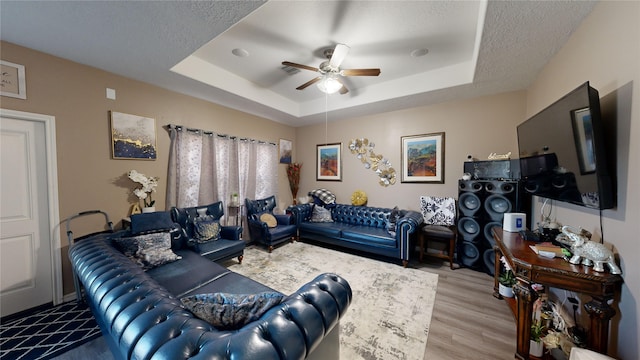 406 Rd 5102 Unit L, Cleveland, TX 77327 - living room featuring a tray ceiling, a ceiling fan, and wood finished floors