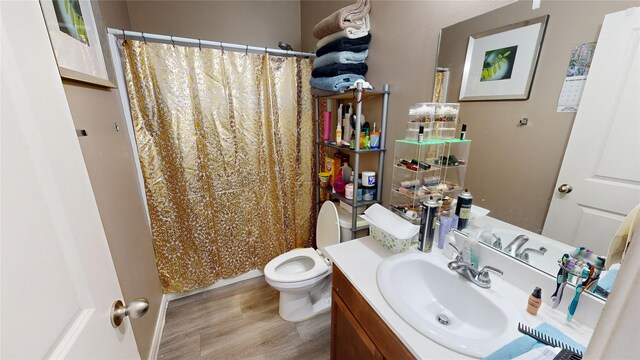 406 Rd 5102 Unit L, Cleveland, TX 77327 - full bathroom with vanity, wood finished floors, and a shower with shower curtain