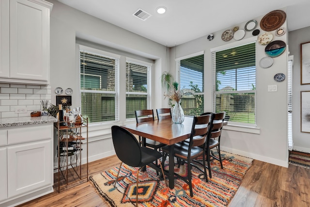 12350 Castano Creek Dr, Humble, TX 77346 - dining space featuring baseboards and light wood-style floors