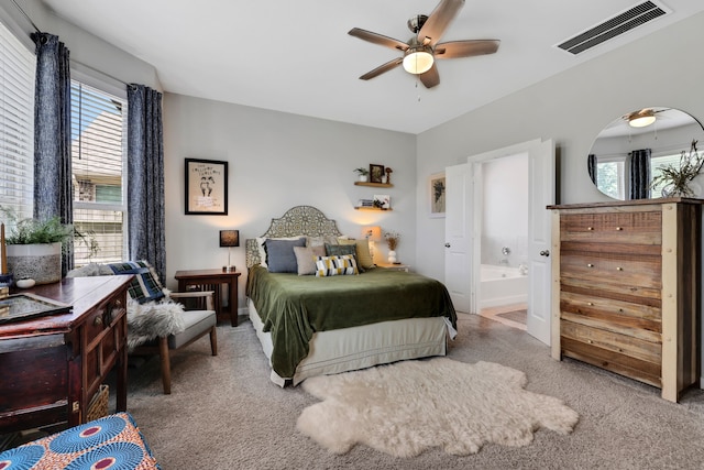 12350 Castano Creek Dr, Humble, TX 77346 - bedroom featuring carpet, multiple windows, ensuite bathroom, and ceiling fan