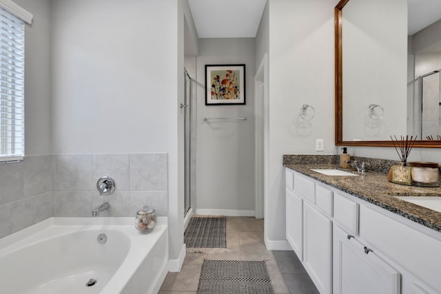 12350 Castano Creek Dr, Humble, TX 77346 - bathroom featuring a garden tub, a stall shower, double vanity, and tile patterned floors