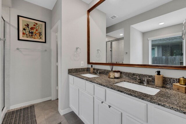 12350 Castano Creek Dr, Humble, TX 77346 - bathroom featuring a shower stall, double vanity, and tile patterned flooring