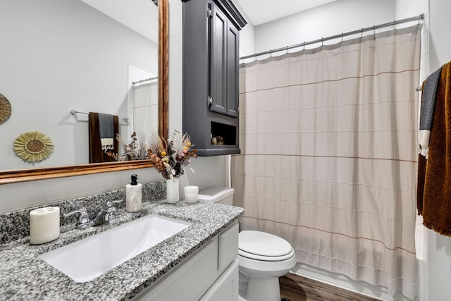 12350 Castano Creek Dr, Humble, TX 77346 - bathroom featuring vanity, wood finished floors, and shower / bath combination with curtain
