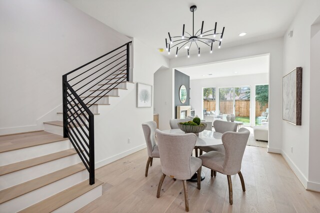 4309 Floyd St Unit B, Houston, TX 77007 - dining room with a chandelier, stairway, light wood finished floors, and recessed lighting