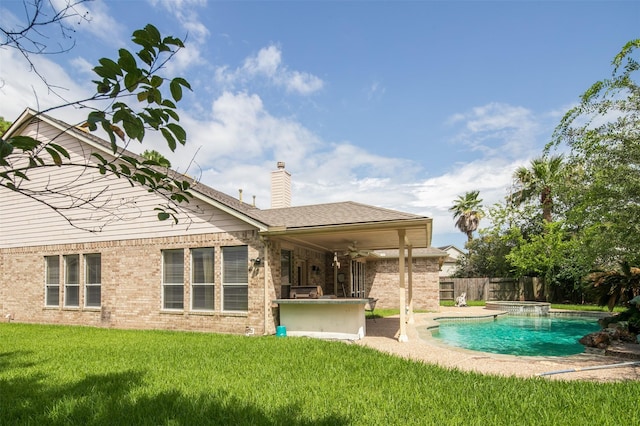 3106 Rainbow Ct, Pearland, TX 77584 - back of property featuring a chimney, a ceiling fan, brick siding, and a patio