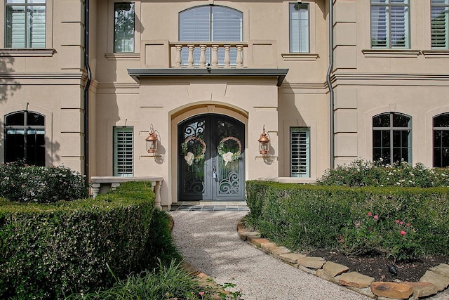 227 Starlight Pl, The Woodlands, TX 77380 - entrance to property featuring stucco siding and french doors