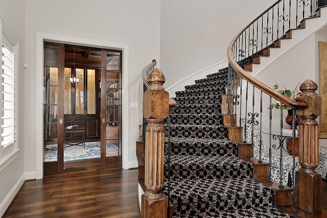 227 Starlight Pl, The Woodlands, TX 77380 - stairs with wood finished floors and baseboards