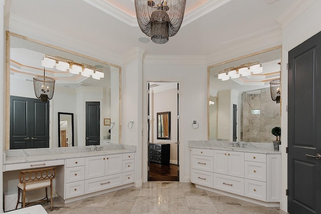 227 Starlight Pl, The Woodlands, TX 77380 - bathroom featuring a raised ceiling, a chandelier, ornamental molding, two vanities, and tiled shower