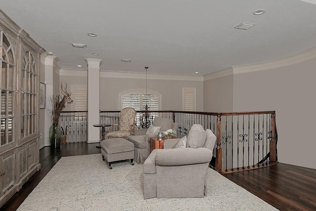 227 Starlight Pl, The Woodlands, TX 77380 - living area with dark wood-style floors, crown molding, recessed lighting, ornate columns, and an upstairs landing
