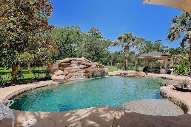227 Starlight Pl, The Woodlands, TX 77380 - swimming pool with a gazebo, an outdoor hot tub, and a patio