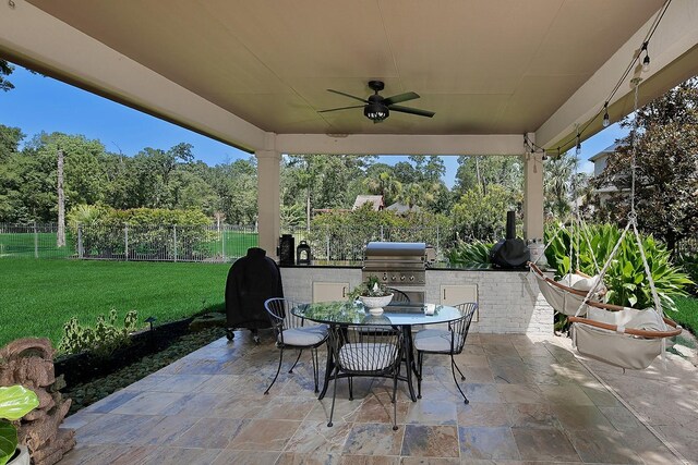 227 Starlight Pl, The Woodlands, TX 77380 - view of patio / terrace featuring ceiling fan, area for grilling, and outdoor dining area