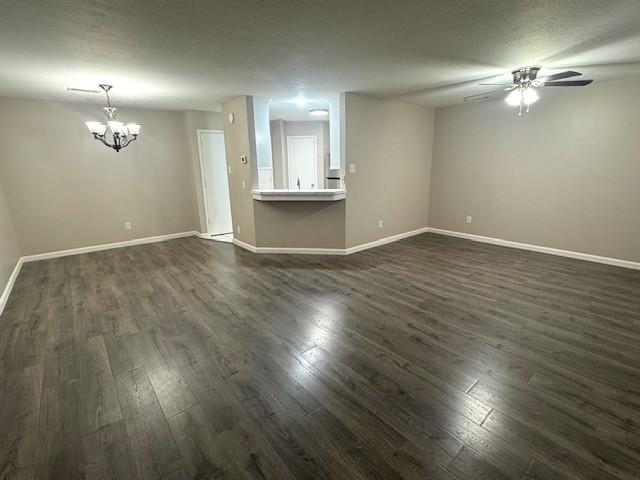 50 Evanston St Unit 5, Houston, TX 77015 - unfurnished living room with dark wood-type flooring, a chandelier, and ceiling fan