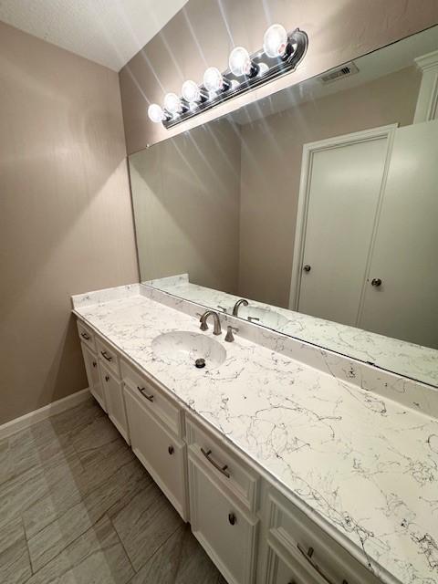 50 Evanston St Unit 5, Houston, TX 77015 - bathroom featuring vanity and baseboards