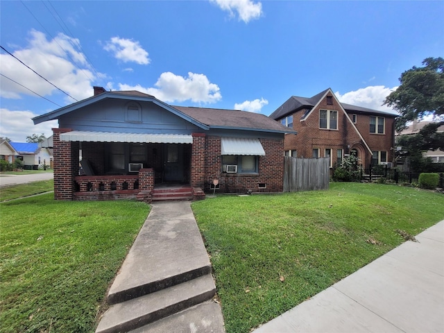 4301 Canal St, Houston, TX 77003 - bungalow-style house featuring brick siding, cooling unit, and covered porch