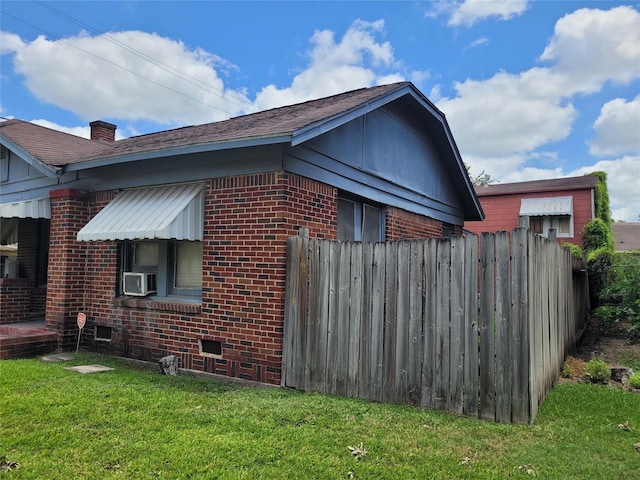 4301 Canal St, Houston, TX 77003 - view of property exterior with brick siding, cooling unit, and a chimney