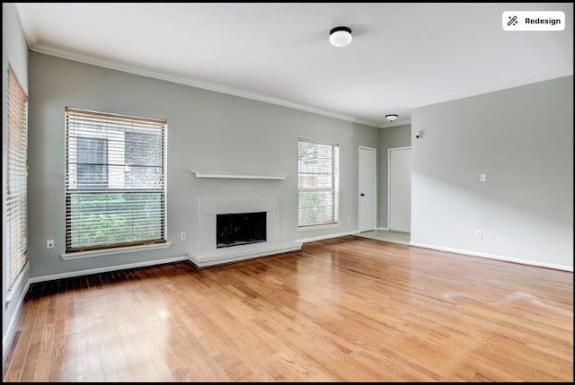 8100 Cambridge St Unit 49, Houston, TX 77054 - unfurnished living room featuring wood finished floors, crown molding, and a tiled fireplace