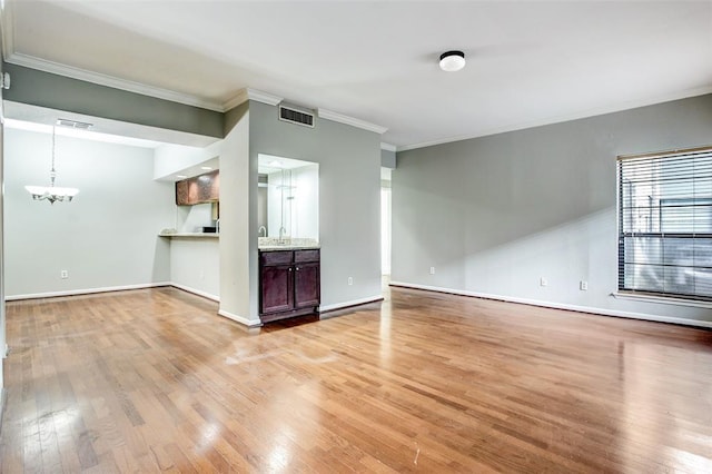 8100 Cambridge St Unit 49, Houston, TX 77054 - unfurnished living room with ornamental molding, light wood-style flooring, and a chandelier