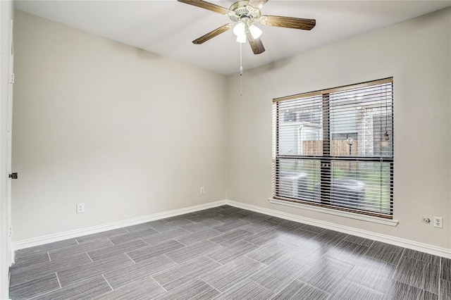 8100 Cambridge St Unit 49, Houston, TX 77054 - spare room with baseboards and a ceiling fan