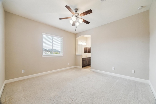 4503 Riley Way Ln, Sugar Land, TX 77479 - unfurnished bedroom featuring arched walkways, light colored carpet, and connected bathroom