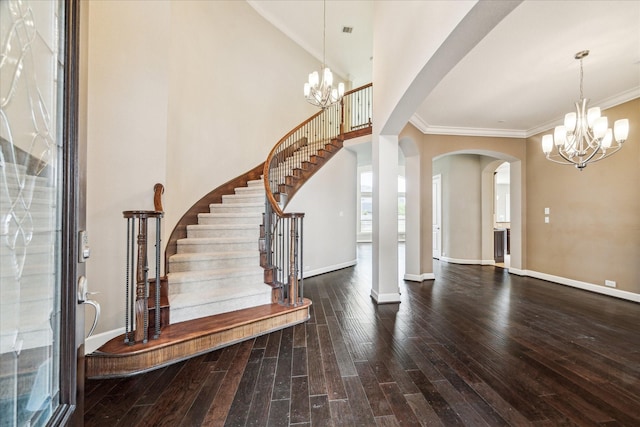 4503 Riley Way Ln, Sugar Land, TX 77479 - foyer entrance featuring a chandelier, arched walkways, hardwood / wood-style floors, stairway, and ornamental molding