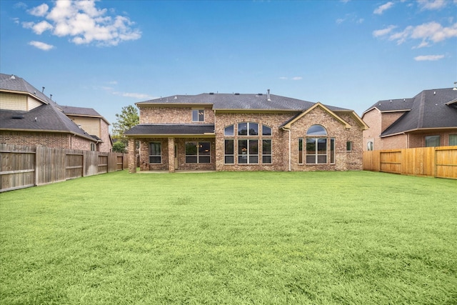 4503 Riley Way Ln, Sugar Land, TX 77479 - rear view of house featuring a fenced backyard and brick siding