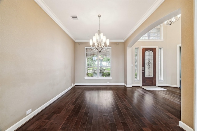 4503 Riley Way Ln, Sugar Land, TX 77479 - foyer entrance with a chandelier, dark wood-type flooring, crown molding, and arched walkways