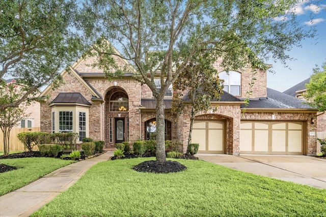 4503 Riley Way Ln, Sugar Land, TX 77479 - french provincial home featuring concrete driveway, brick siding, and a front lawn