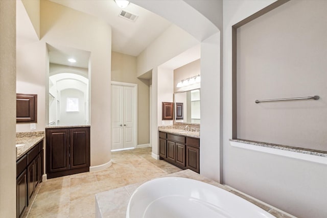 4503 Riley Way Ln, Sugar Land, TX 77479 - full bath with two vanities, a bath, and tile patterned flooring