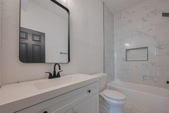 1014 13th St, Galveston, TX 77550 - full bath with vanity, bathing tub / shower combination, a textured wall, and marble finish flooring