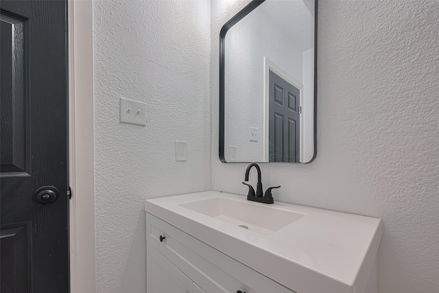 1014 13th St, Galveston, TX 77550 - bathroom with a textured wall and vanity