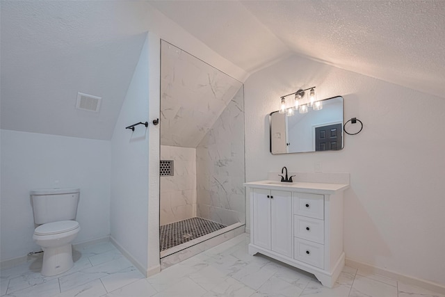 1014 13th St, Galveston, TX 77550 - bathroom featuring marble look tile flooring, lofted ceiling, vanity, a shower stall, and a textured ceiling