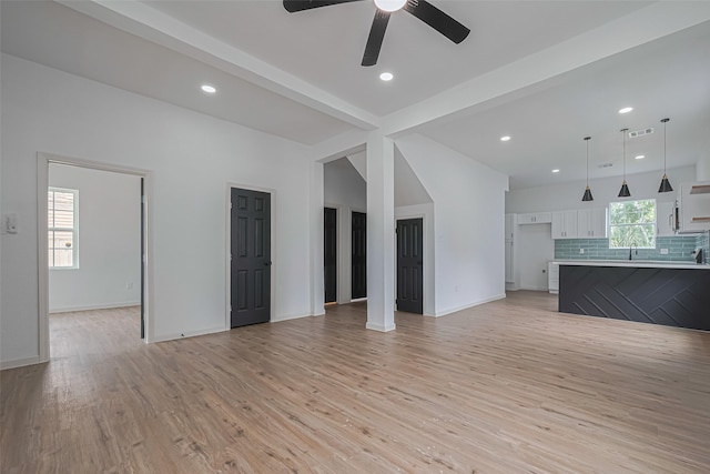 1014 13th St, Galveston, TX 77550 - unfurnished living room with light wood-style floors, a ceiling fan, and recessed lighting