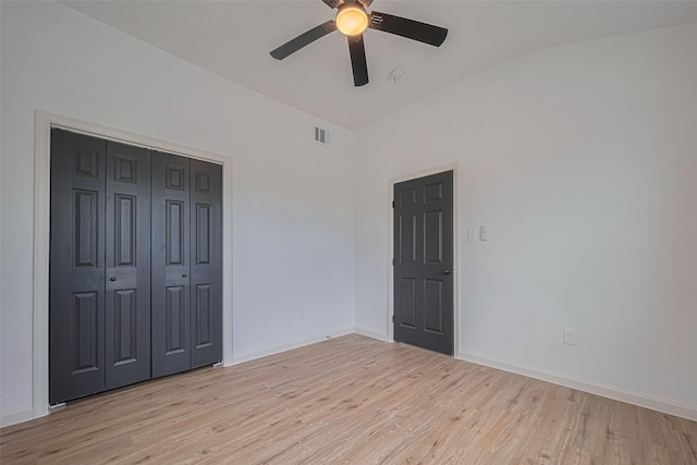 1014 13th St, Galveston, TX 77550 - unfurnished bedroom with light wood finished floors, a closet, and ceiling fan