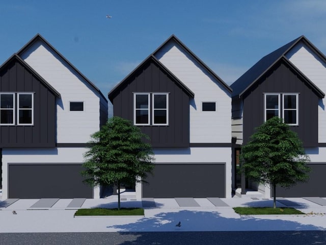 5022 Broom St, Houston, TX 77091 - view of front of home with board and batten siding and an attached garage