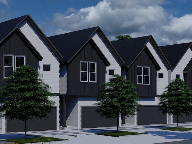 5022 Broom St, Houston, TX 77091 - view of front facade with board and batten siding and an attached garage
