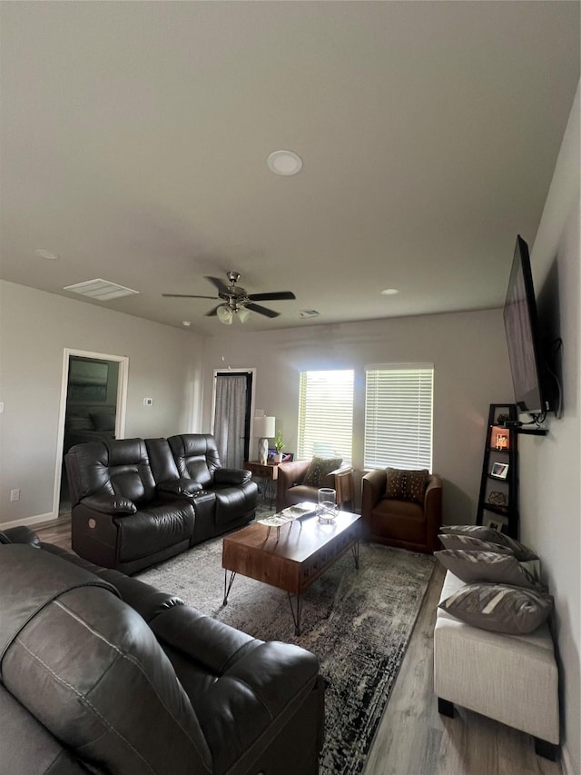 11577 Gingerland Dr, Conroe, TX 77304 - living room with wood finished floors, a ceiling fan, and recessed lighting