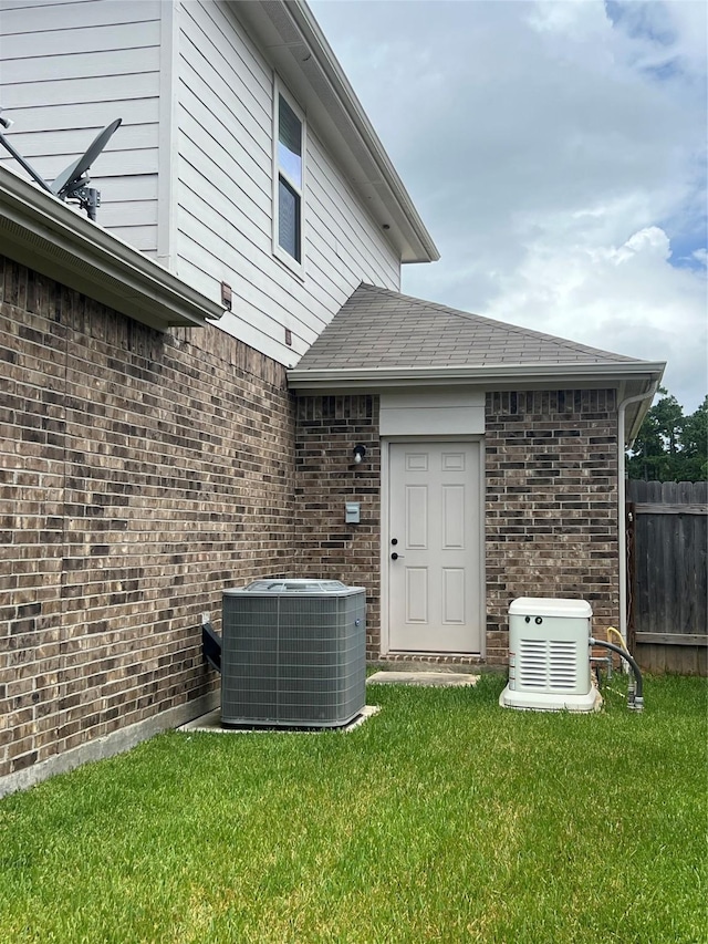 11577 Gingerland Dr, Conroe, TX 77304 - rear view of house featuring brick siding