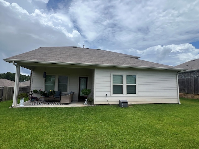 11577 Gingerland Dr, Conroe, TX 77304 - rear view of house with a patio, an outdoor living space, and roof with shingles