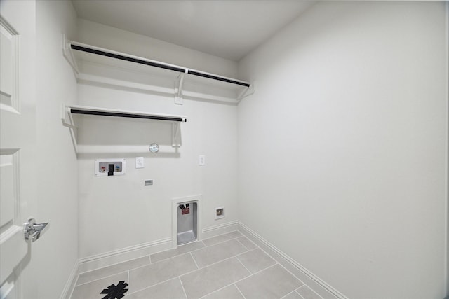 1805 Mills St, Houston, TX 77026 - washroom featuring hookup for a gas dryer, light tile patterned flooring, and washer hookup