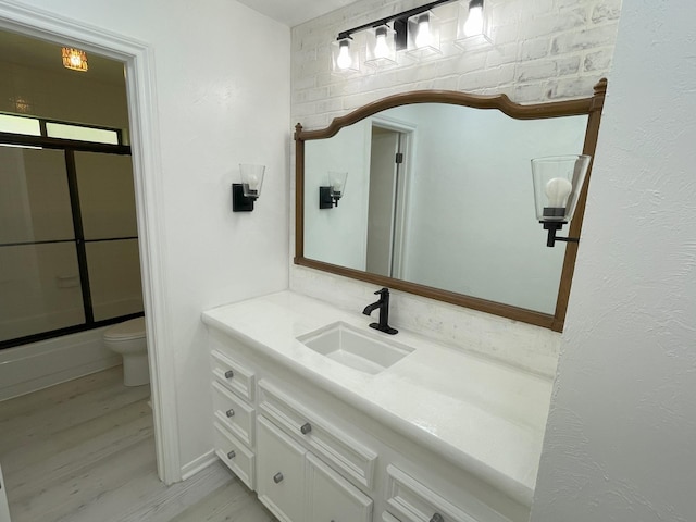 3419 Willowrun Dr, Montgomery, TX 77356 - bathroom featuring vanity, a shower with shower door, and wood finished floors