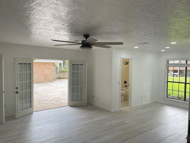 3419 Willowrun Dr, Montgomery, TX 77356 - empty room with wood finished floors, french doors, a ceiling fan, a textured ceiling, and recessed lighting