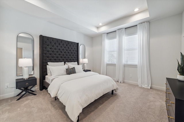 1804 Elysian St, Houston, TX 77026 - bedroom featuring light colored carpet, recessed lighting, and a tray ceiling