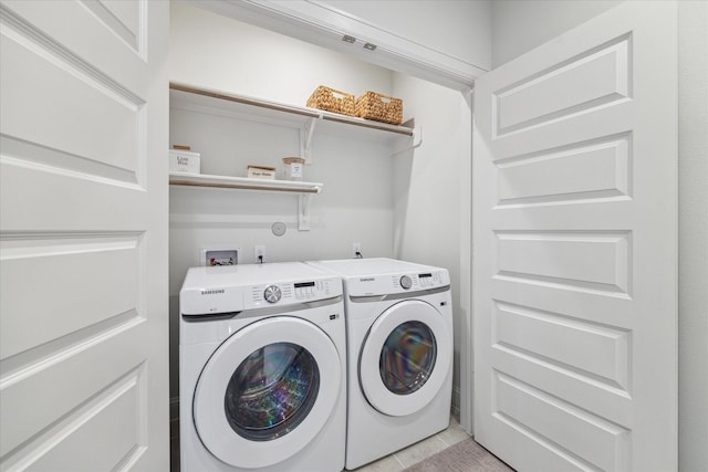 1804 Elysian St, Houston, TX 77026 - washroom featuring separate washer and dryer and light tile patterned flooring