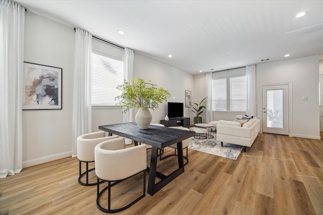 1804 Elysian St, Houston, TX 77026 - living room featuring light wood-type flooring and recessed lighting