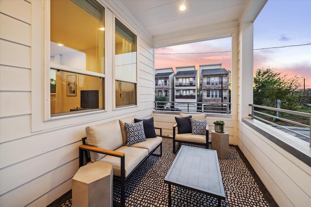 1804 Elysian St, Houston, TX 77026 - balcony at dusk with an outdoor living space and cooling unit